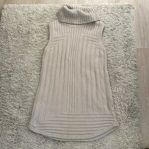 Tan sleeveless turtleneck sweater. Tahari. L. One small hole in bottom as shown.